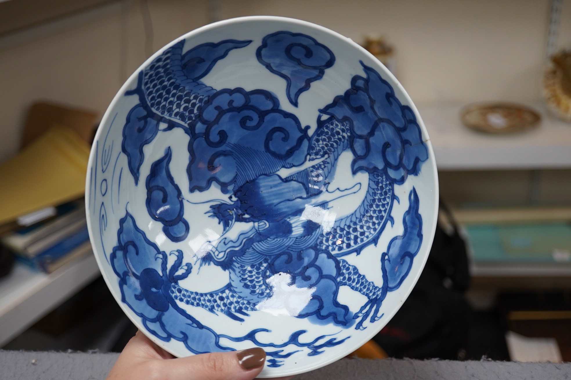 A Chinese blue and white ‘cloud and dragon’ bowl, Yongzheng mark and period (1723-35)